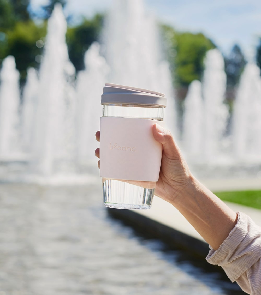 water hydration in bobanc reusable glass cup by the lake